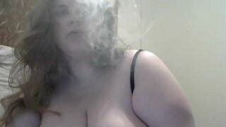 Huge DDD tit wife smokes while playing with her big tits and hard nipples