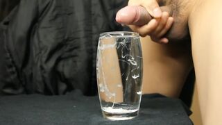 cumming in a glass of water