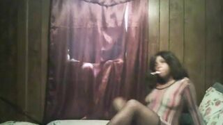 sexy black girl smoking in see through dress