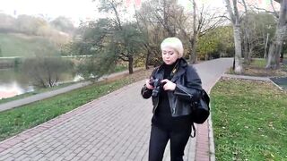 a mature woman with a camera walks about the park, and no one even guesses that she is a famous whore .!. ))