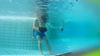He Puts His Hands Under Her Swimming Trunks And Massages Her Ass