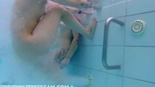 In This Underwater Video We See A Lot Of Piercings And Tattoos