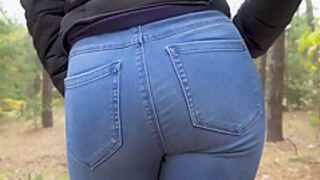 Amateur teen 18+ In Blue Jeans Teasing Her Tight Ass In The Forest