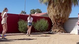 Three Players In A Strip Version Of The Volleyball Game