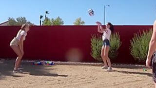 Three Players In A Strip Version Of The Volleyball Game